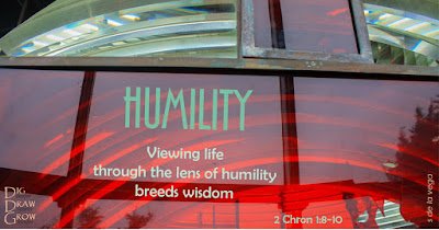 Lighthouse lens displaying caption "Humility: Viewing life through the lens of humility breeds wisdom"