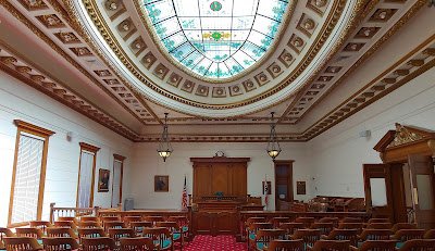 Empty courtroom looking toward the judge's podium
